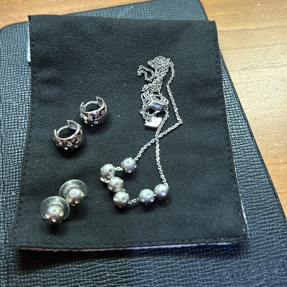 Brushed silver tone necklacece, matching studs and similar “Huggie”s.